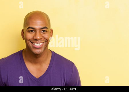 Close up portrait of smiling mid adult male Stock Photo