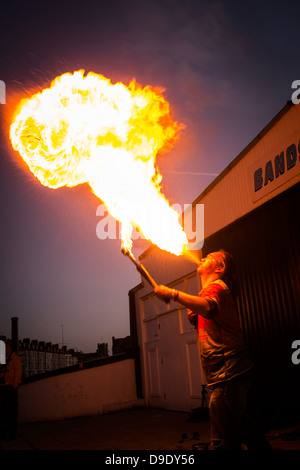 A man breathing fire, dusk, UK Stock Photo