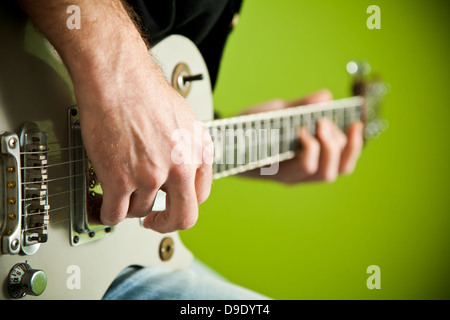 Close up of an electric guitar being played. Stock Photo