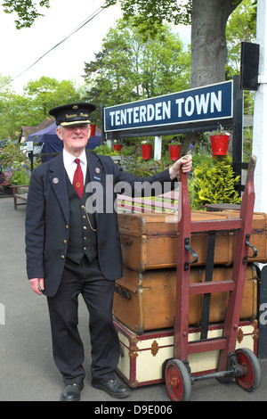 Station Master with vintage luggage at Tenterden Kent and East Sussex Railway Station England UK GB Stock Photo