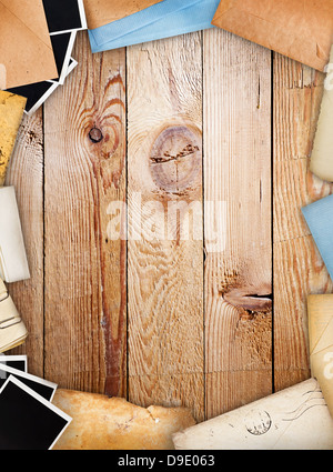 Frame with old paper and instant photos. Objects over old wood background Stock Photo