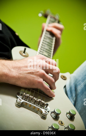 Close up of an electric guitar being played. Stock Photo