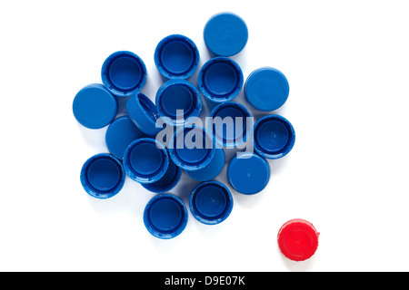 Group of blue plastic caps and one red Stock Photo