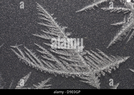 patterns form in ice on the bonnet of a car during an overnight frost Stock Photo