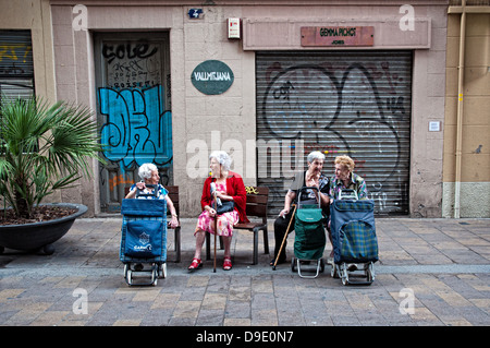 Elderly women sitting on a bench in Gracia neighborhood. Barcelona, Cataluña, Spain Stock Photo