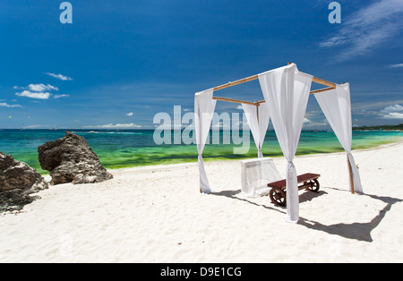 Wedding arch on tropical beach  Stock Photo