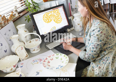Ceramics designer working on computer Stock Photo