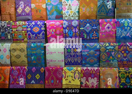 Indonesia, Bali, Klungkung, selling fabric at the market Stock Photo