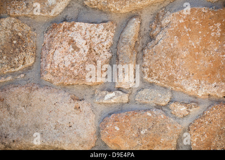 Rustic stone block wall background. Stock Photo