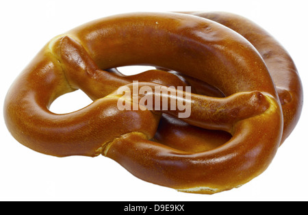Two freshly baked pretzels isolated on white. Stock Photo