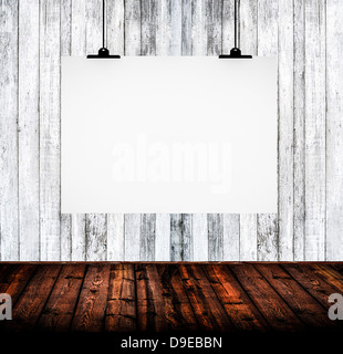 Interior of empty room with white paper hanging on paper clips Stock Photo