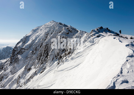 View from marker pillar at the top of the Pyg Track towards Snowdon summit (Yr Wyddfa). Stock Photo