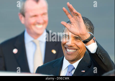 Berlin, Germany. 18th June, 2013. US President Barack Obama waves as he arrives at Tegel Airport in Berlin, Germany, 18 June 2013. US ambassador to Germany Philip D. Murphy at left. Photo: Maurizio Gambarini/dpa /dpa/Alamy Live News Stock Photo