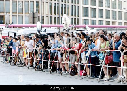 Berlin, Germany. 18th June 2013. The highest level of security is in place during the visit of the American President Obama in Berlin. Around the Potsdamer Platz a barrier was erected. Spectators try to get a look at what is happening. Credit:  Marcus Krauss/Alamy Live News Stock Photo