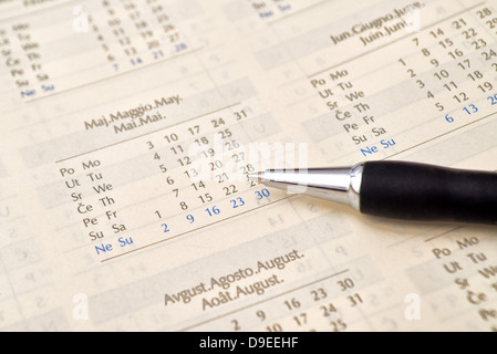 Ballpoint pen and agenda calendar, business background. Stock Photo