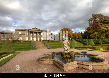 Neoclassical mansion house and fountain in the terraced garden at the Tatton Park, Cheshire. Stock Photo