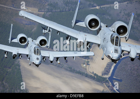 Two A-10C Thunderbolt II aircraft fly in formation. Stock Photo