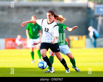 18.06.2013 Dublin, Ireland. Lisa Makas (Austria) controls the ball under pressure from Meabh De Burca (Rep. of Ireland)  during the Women's International Friendly between the Rep. of Ireland and Austria from Tallaght Stadium. Stock Photo