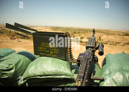 A M240B medium machine gun is positioned at an observation post. Stock Photo