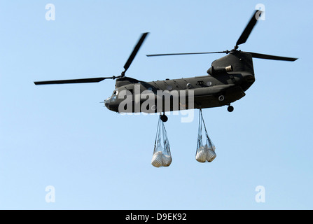 A CH-47 Chinook carrying sandbags. Stock Photo