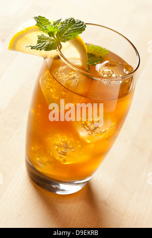 Refreshing Iced Tea with Lemon against a background Stock Photo