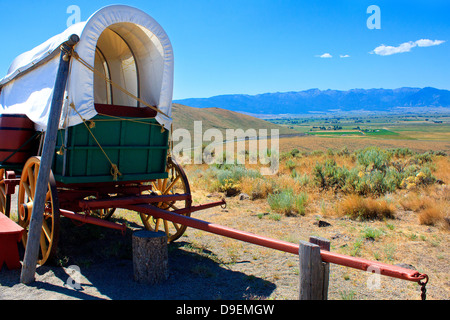 19th-century covered wagon replica outside National Historic Oregon Trail Interpretive Center in Baker City, Oregon Stock Photo