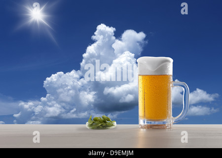 Beer, soybeans and blue sky with clouds Stock Photo