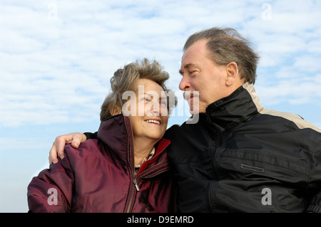 Senior citizen's pair, happily and in love, in autumnal clothes.  (Model release) Stock Photo