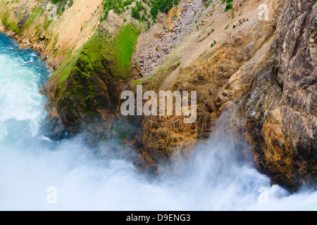 Mist billows from brink of Lower Falls into Yellowstone River in Yellowstone National Park, Wyoming Stock Photo