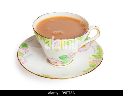Cup of Tea with milk in a pretty bone china cup, freshly poured with bubbles on surface, front to back focus, isolated on... Stock Photo