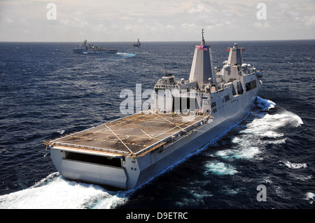 Rear view of USS Green Bay with a convoy of ships in the Indian Ocean. Stock Photo