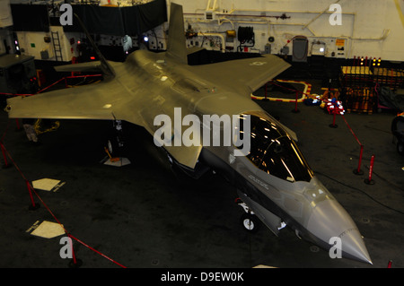 October 4, 2011 - An F-35B Lightning II is secured in the hangar bay aboard the amphibious assault ship USS Wasp (LHD 1). Stock Photo
