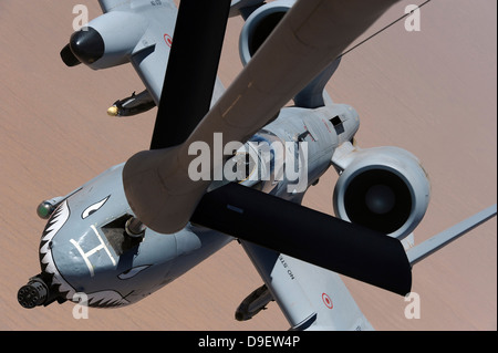 An A-10 Thunderbolt II receives fuel from a KC-135 Stratotanker. Stock Photo