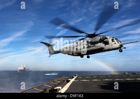 A CH-53E Super Stallion prepares to land on USNS Arctic. Stock Photo