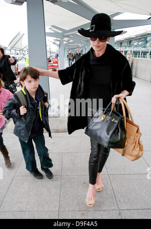 Catherine Zeta Jones and son Dylan Douglas arriving at Heathrow Airport London, England - 25.02.11 Stock Photo