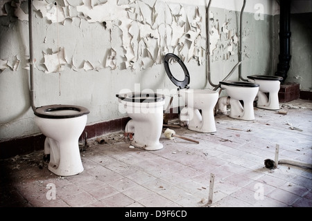 Old toilet washbasins in a row, Old toilet bowl in a row Stock Photo