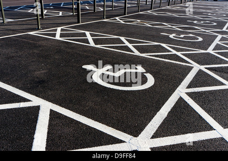 Disabled parking spaces in a supermarket car park.