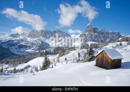 Mounts Lavarella and Conturines behind a pair of barns at the Alta Badia ski resort near Corvara, Dolomites, South Tyrol, Italy Stock Photo