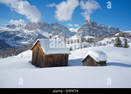 Mounts Lavarella, Conturines and Sasongher behind barns at the Alta Badia ski resort near Corvara, Dolomites, South Tyrol, Italy Stock Photo