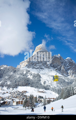 View of Corvara and gondola at the Alta Badia ski resort with Sassongher Mountain behind, Dolomites, South Tyrol, Italy Stock Photo