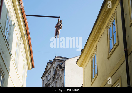 Hanging man above the street by David Cerny, Prague, Czech Republic Stock Photo