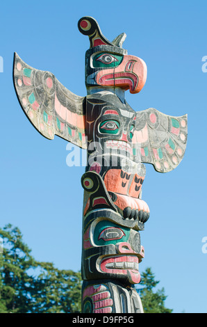 Totem poles in cemetery in Alert Bay, British Columbia, Canada Stock Photo