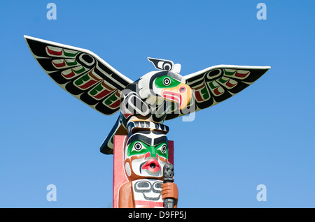 Totem poles in cemetery in Alert Bay, British Columbia, Canada Stock Photo