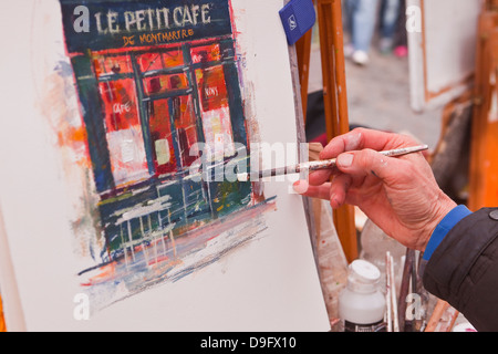 A street artist at work in the famous Place du Tertre in Montmartre, Paris, France Stock Photo