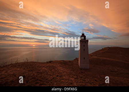 Rubjerg Knude Fyr (lighthouse) buried by sand drift at sunset, Lokken, Jutland, Denmark, Scandinavia Stock Photo