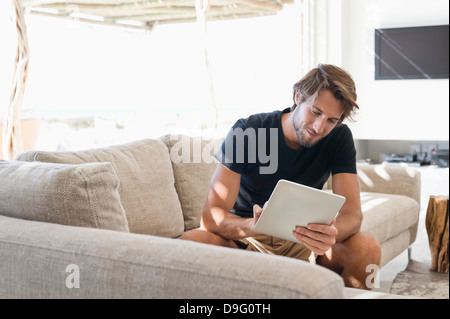 Man using a digital tablet Stock Photo