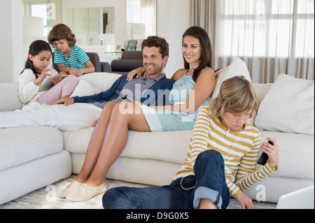Family using electronics gadget Stock Photo