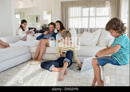 Family using electronics gadget Stock Photo