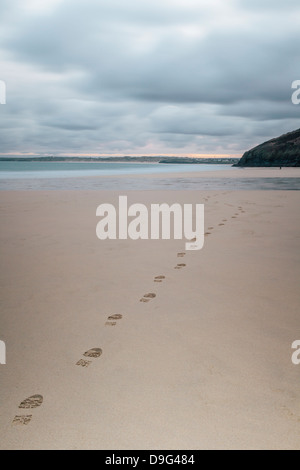 Footsteps in the sand, Carbis Bay beach, St. Ives, Cornwall, England, UK