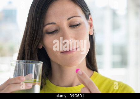 Close-up of a woman taking medicine Stock Photo